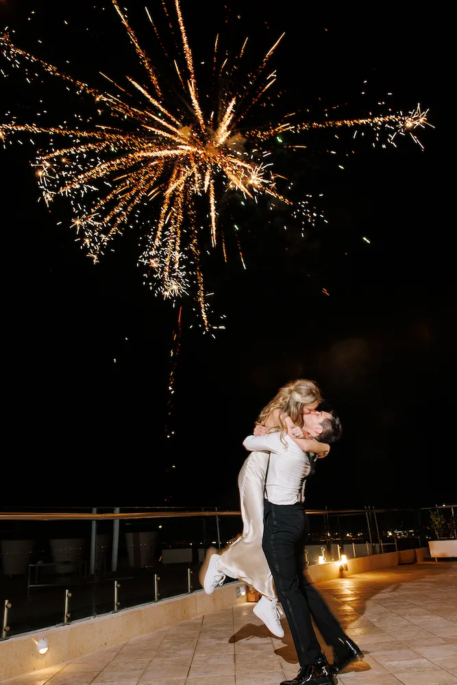 Couple's first kiss at an outdoor ceremony overlooking Banderas Bay, Puerto Vallarta